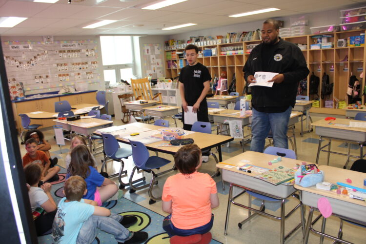 Dispatchers teach students about 911
